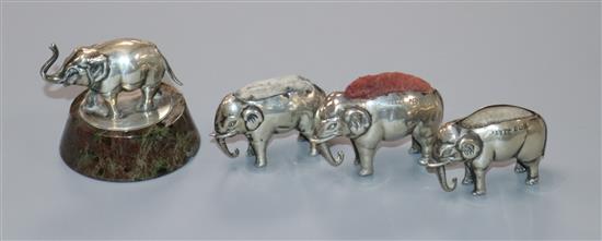 Three Edwardian novelty silver elephant pin cushions, Birmingham, 1905/6 and a miniature silver elephant on hardstone base,